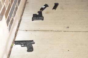 The Smith and Wesson .40 calibre handgun with two full handgun magazines and a magazine holder, which were located against the wall of the Danforth Church and next to Faisal Hussain’s body. (SIU)