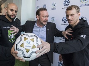 Kyle Porter (L) York9 player, CPL Commissioner David Clanachan (M), and Kyle Becker, Forge FC player. at the announcement of the CPL's first game on Tuesday January 29, 2019. Craig Robertson/Toronto Sun