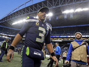 Seattle Seahawks quarterback Russell Wilson walks off the field after an NFL football game against the Arizona Cardinals, Sunday, Dec. 30, 2018, in Seattle.