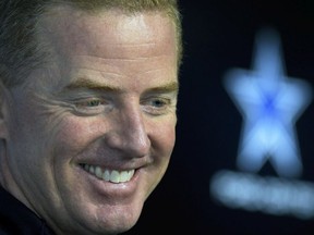 Dallas Cowboys head coach Jason Garrett smiles as he talks to the media about how well wide receiver Amari Cooper (19) fits in with the team before the morning practice, Thursday, Jan. 10, 2018 in Frisco, Texas.