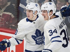 Toronto Maple Leafs' Auston Matthews (34) celebrates with teammate Mitchell Marner after scoring against the Montreal Canadiens during third period NHL hockey action in Montreal on November 18, 2017.