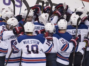 Team United States celebrates their win over Russia following third period IIHF world junior semifinal hockey action in Vancouver, Friday, Jan. 4, 2019.