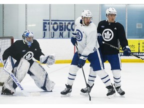 Toronto Maple Leafs Jake Gardiner D (51) in front of the net with teammate Frederik Gauthier C (33) during practice at the MCC in Toronto on Wednesday January 16, 2019. Jack Boland/Toronto Sun/Postmedia Network
