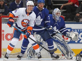 Maple Leafs goaltender Garret Sparks (right), keeps track of the play as Islanders’ Brock Nelson and Leafs’ Auston Matthews look on last Saturday in Toronto. Sparks is in line to make his fourth consecutive start on Thursday against the Wild. (GETTY IMAGES)
