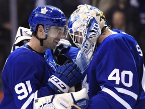 Maple Leafs’ John Tavares celebrates with Garret Sparks following a win in October. Sparks will start against the Wild today. (CP FILE)