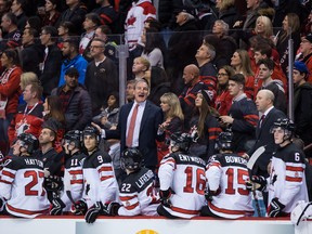 Canada head coach Tim Hunter stands on the bench during third-period IIHF world junior hockey championship action against Russia, in Vancouver on Monday, Dec. 31, 2018. (THE CANADIAN PRESS)