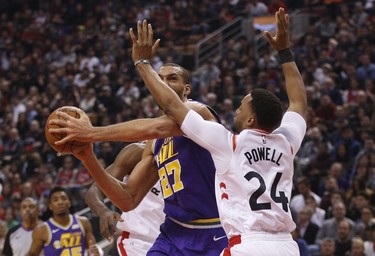 Toronto Raptors Norman Powell SF (24) defends against Utah Jazz Rudy Gobert C during the first quarter  in Toronto, Ont. on Tuesday January 1, 2019. Jack Boland/Toronto Sun/Postmedia Network
