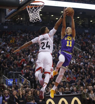 Utah Jazz Dante Exum PG (11) drops in two points against Toronto Raptors Norman Powell SF (24) during the first quarter  in Toronto, Ont. on Tuesday January 1, 2019. Jack Boland/Toronto Sun/Postmedia Network