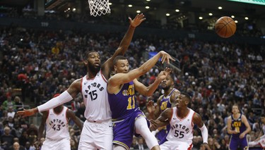 Utah Jazz Dante Exum PG (11) deals off a pass in front of Toronto Raptors Greg Monroe C (15) during the first quarter  in Toronto, Ont. on Tuesday January 1, 2019. Jack Boland/Toronto Sun/Postmedia Network
