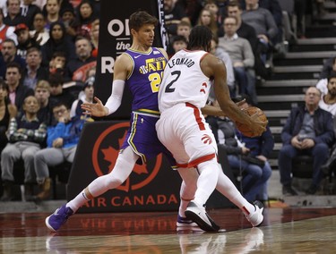 Toronto Raptors Kawhi Leonard SF (2) tries to go around Utah Jazz Kyle Korver SG (26) during the second quarter  in Toronto, Ont. on Tuesday January 1, 2019. Jack Boland/Toronto Sun/Postmedia Network