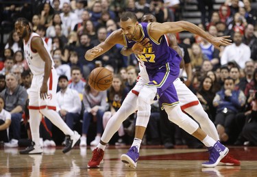 Toronto Raptors Serge Ibaka PF (9) reaches in to knocks the ball from the hands of Utah Jazz Rudy Gobert C (27) during the second half in Toronto, Ont. on Tuesday January 1, 2019. Jack Boland/Toronto Sun/Postmedia Network