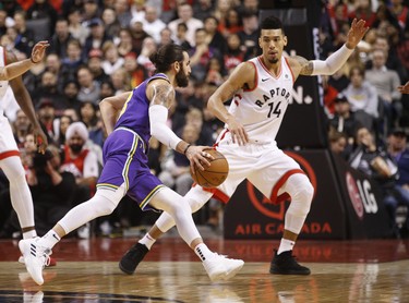 Toronto Raptors Danny Green SG (14) guards against Utah Jazz Ricky Rubio PG (3) during the second half in Toronto, Ont. on Tuesday January 1, 2019. Jack Boland/Toronto Sun/Postmedia Network