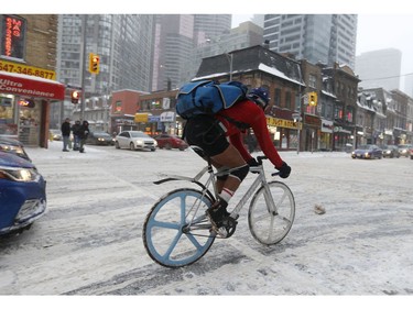 Dennis (pictured) the bike courier said he always wears shorts all year round as he braved the first major snowfall of the year to hit Toronto at Yonge and Wellesley St. E. . Environment Canada called it "hazardous winter conditions" with snowfall up to 25 centimetres. Temps midday were were -7 C at 4 p.m. but 65 kmh winds made it feel like -18C on Monday January 28, 2019. Jack Boland/Toronto Sun/Postmedia Network