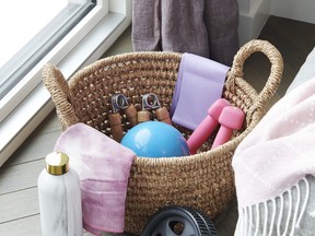 A handsome basket keeps workout gear (from Winners) tidy and top of mind.
