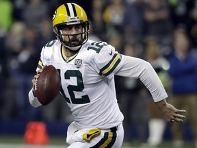 In this Nov. 15, 2018, file photo, Green Bay Packers quarterback Aaron Rodgers looks to pass against the Seattle Seahawks in Seattle. (AP Photo/Elaine Thompson, File)