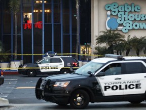 Police investigate the scene of a shooting that left three men dead and four injured at Gable House Bowl on January 5, 2019 in Torrance, California. Witnesses said a large group of people were bowling together when a fight erupted which led to the shooting. (Mario Tama/Getty Images)