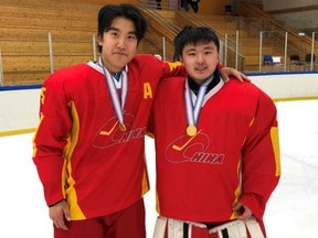 Eddie Yan (left) and Sean Wu are all smiles after winning gold with Team China at the IIHF under-20 Division III world championship in Iceland. The childhood friends moved from Beijing to Toronto to pursue their hockey dreams. (SUBMITTED PHOTO)