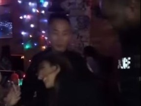 Video shows two uniformed Toronto Police officers partying at a bar in the Entertainment District.