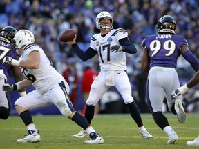 Los Angeles Chargers quarterback Philip Rivers (17) throws a pass in the second half of an NFL wild card playoff football game against the Baltimore Ravens, Sunday, Jan. 6, 2019, in Baltimore. (AP Photo/Carolyn Kaster)