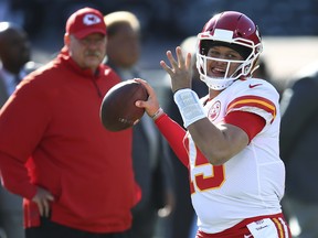 Chiefs coach Andy Reid (left) and quarterback Patrick Mahomes take on the Patriots in Kansas City on Sunday.  AP