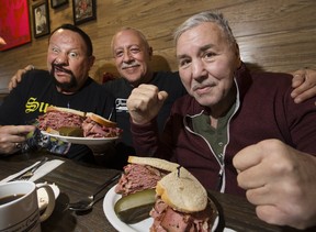 Boxing great George Chuvalo (far right) had a sandwich named after him by Lorne Pancer (middle) at Pancer's Original Delicatessen, 3856 Bathurst St., in North York, on Thursday, Jan. 31, 2019. WWE wrestler Bushwhacker Luke (far left) was also on hand. (Stan Behal/Toronto Sun/Postmedia Network)