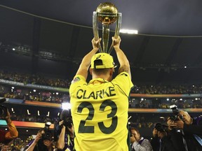 Michael Clarke of Australia celebrates with the trophy during the 2015 ICC Cricket World Cup final match between Australia and New Zealand at Melbourne Cricket Ground on March 29, 2015 in Melbourne. Australia defends its title at the 2019 Cricket World Cup in England, starting May 30.  (RYAN PIERSE/Getty Images files)