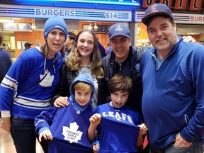 Mike Wilson, back second from right, with Jon Harris, nephew of Leafs ‘60s star Billy, his wife Jen and children Grace, Henry and Cam at the Maple Leafs game in Columbus. Supplied