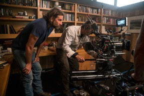 Director/co-writer/producer Bradley Cooper, left, and camera operator Scott Sakamoto on the set of A Star is Born. Cooper was not nominated for an Oscar for best director for his work on the film. He was nominated for best actor for his role in the film. (Clay Enos/Warner Bros.)