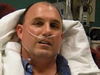 Dave Sanderson is pictured in hospital after the crash. (Dave Sanderson photo)