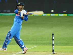 Indian batsman Mahendra Singh Dhoni hits the ball during the second one-day international cricket match between Australia and India at the Adelaide Oval on Jan. 15, 2019. (GETTY IMAGES)