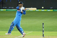 Indian batsman Mahendra Singh Dhoni hits the ball during the second one-day international cricket match between Australia and India at the Adelaide Oval on Jan. 15, 2019. (GETTY IMAGES)
