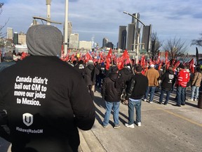 Unifor members gather on the riverfront in Windsor ahead a rally.