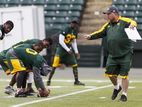 Special Teams Coordinator Cory McDiarmid (right) works with players during an Eskimos walkthrough at Commonwealth Stadium in Edmonton. McDiarmid is expected to take over the same role with the Argos after not being re-hired by the Esks. (Ian Kucerak, Postmedia)