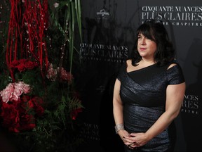 In this Feb. 6, 2018 file photo, E.L. James poses during a photocall for the world premiere of 'Fifty Shades Freed - 50 Nuances Plus Claires' at Salle Pleyel in Paris. (AP Photo/Francois Mori, File)