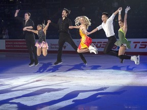 Gold Medallists Michael Marinaro and Kirsten Moore-Towers, pairs, Andrew Poje and Kaitlyn Weaver, ice dance, Nam Nguyen, senior men, and Alaine Chartrand, senior women, left to right, jump as they pose for a photo at the exhibition gala event at the 2019 National Skating Championships at Harbour Station in Saint John, N.B. on Sunday, Jan. 20, 2019. THE CANADIAN PRESS/Andrew Vaughan