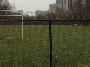 Razor wire installed over fence surrounding Branksome Hall playing field.