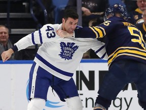 BUFFALO, NY - MARCH 5: Nazem Kadri #43 of the Toronto Maple Leafs and Rasmus Ristolainen #55 of the Buffalo Sabres fight during the second period at KeyBank Center on March 5, 2018 in Buffalo, New York. (Photo by Kevin Hoffman/Getty Images)