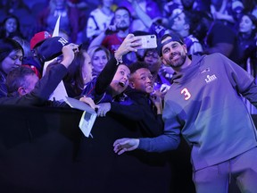 New England Patriots kicker Stephen Gostkowski poses with fans on Monday during Super Bowl LIII Opening Night at State Farm Arena in Atlanta. (Kevin C. Cox/Getty Images)