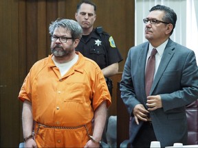 In this April 20, 2017 file photo, defendant Jason Dalton, left, who is charged with killing six people in-between picking up riders for Uber, stands with attorney Eusebio Solis during a hearing in Kalamazoo, Mich.