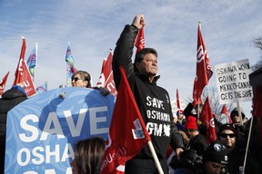 Jerry Dias, the national president for Unifor, the national union representing auto workers, addresses a rally within view of General Motors headquarters, Friday, Jan. 11, 2019, in Windsor, Ont. Workers were protesting the closing of the Oshawa assembly plant, (AP Photo/Carlos Osorio)