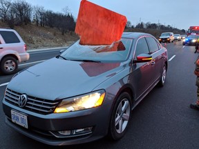 A piece of plywood is seen after it flew off a vehicle and went through the windshield of another on Hwy. 410 on Jan. 2, 2019. (Kerry Schmidt/Twitter)