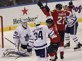 Toronto Maple Leafs goaltender Garret Sparks reacts after the Florida Panthers scored as Florida Panthers center Nick Bjugstad cheers during the first period of an NHL hockey game Friday, Jan. 18, 2019, in Sunrise, Fla. (AP Photo/Brynn Anderson)
