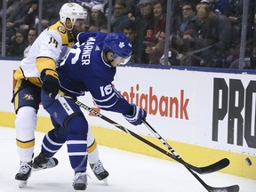 Toronto Maple Leafs right wing Mitchell Marner and Nashville Predators defenceman Mattias Ekholm in Toronto on Monday Jan. 7, 2019.