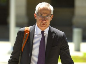 Dr. Dirk Huyer, the Chief Coroner for Ontario, leaves the Elgin courthouse in St. Thomas July 17, 2018.  (Mike Hensen/Postmedia Network)