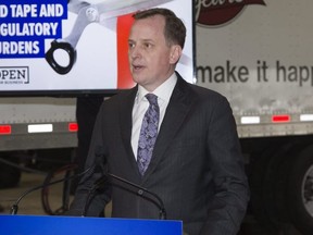 Minister of Transportation Jeff Yurek announces that Ontario will be implementing the Drivewyze PreClear bypass service in London, Ont. on Thursday January 24, 2019. Derek Ruttan/Postmedia Network
