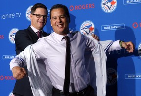Jays GM Ross Atkins introduces Charlie Montoyo as the team’s manager last October. Aside 
from Justin Smoak at first base, Montoyo expects his lineup to be fluid. (Dave Abel/Toronto Sun Files)