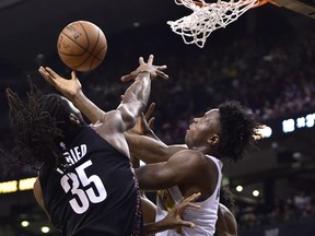 Raps forward OG Anunoby (right) was part of a unit that had their way with Brooklyn’s reserves in Friday’s win. (The Canadian Press)