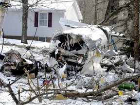 Debris lies on the ground after a deadly plane crash near Kidron, Ohio, Monday, Jan. 21, 2019.