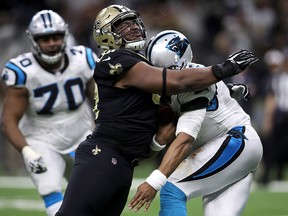 David Onyemata of the New Orleans Saints tackles Cam Newton of the Carolina Panthers at the Mercedes-Benz Superdome on January 7, 2018 in New Orleans. (Chris Graythen/Getty Images)