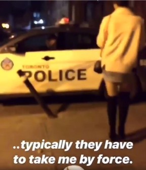 A still from a series of videos posted to social media depicting Toronto Police officers Sunday evening pretending to handcuff bar patrons.